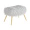 Soft fluffy white pouf with wooden legs on an isolated background. 3d rendering