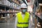 Soft focus asian engineer or technician wearing mask,safety hard hat,uses digital tablet check merchandise stock,security cargo