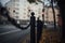 Soft focus of black metal chain railings on the street during fall