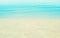 Soft focus blue sea and sand beach background