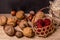 Soft focus, blurring background. Hazelnuts and walnuts. Raspberry wicker basket. Macro.