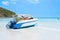 Soft focus boat on the beach with blue sky