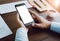 Soft focus of businessman hand working with phone on desk in table. Vintage tone