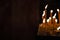 Soft focus candle fire religion service wallpaper pattern picture on dark background empty copy space for your text here