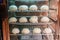 Soft focus chinese pork bun or steamed dumpling in steam cabinet warming for sale ready to eat in mini mart , Chinese food