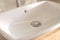 Soft focus close up white luxury washbasin, no tap