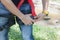 Soft focus close up young man Asian wear the safety harness for job at high