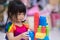 Soft focus. Cute children play with colorful plastic blocks. Create small pieces. Learning. Development of fine muscles.