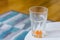 Soft focus of an emptied out drinking glass on a table used for drinking orange juice