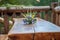 Soft focus of a floral centerpiece on a wooden table at Hija glamping Lake Bloke in Slovenia