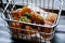 Soft focus of fried pork in the Iron basket on black plate in restaurant, copy space