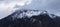 Soft focus moody mountain winter peak Alp highland panoramic landscape winter time gray sky background