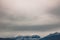 Soft focus mountain landscape moody foggy dramatic weather time nature gorgeous scenic view with gray sky background and empty