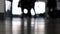 Soft focus people walking through an airport terminal with suitcases, bags and baggage