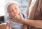 The Soft focus photo of mother, mom using hand Hold baby to help a baby newborn infant belch burping after breastfeeding milk to