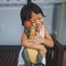 Soft focus photo vintage style child Asia girl hugs dinosaurs doll happily. She is smiled very happy, Happy child girl concept, Be