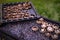 Soft focus of prepared portabella mushrooms stuffed with cheese on a grill