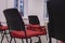 Soft focus red chairs in hall interior indoor space without people