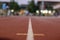 Soft focus Red running track and bokeh background in stadium. rubber running tracks in outdoor stadium.