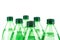 Soft focus of rows of plastic bottles with mineral water on a white background.
