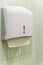 Soft focus tissues paper towel dispenser on granite wall in barthroom