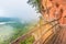 The soft focus of wooden bridge, balcony at mountain side, the women,green forest foggy hills at Phu Tok ,Bung Kan province, Thail