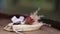 Soft focused beautiful wedding rings with champagne glasses on barrel. Slowmo