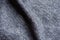 Soft fold on heather blue woolen fabric