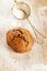 Soft ginger cookie on dusted wooden table