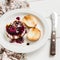 Soft goat cheese with berry sauce, balsamic vinegar and nuts - a delicious appetizer with wine