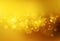 Soft golden lights. Abstract vector bokeh background.