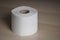 Soft hygienic toilet paper on wood background