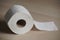 Soft hygienic toilet paper on wood background