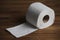 Soft hygienic toilet paper on wood background