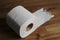 Soft hygienic toilet paper on wood background