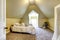 Soft ivory bedroom with vaulted ceiling