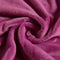 A soft magenta fleece fabric its texture soft and warm. Trendy color of 2023 Viva Magenta.. AI generation