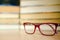 Soft magic glasses, blur books stack on wooden table