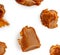 Soft melted caramel Pattern. Golden Butterscotch toffee candy isolated on a white background Macro