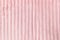 Soft pastel pink throw fleece fabric with lines. Texture for background