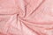 Soft pastel pink throw fleece fabric with lines. Texture for background