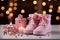 Soft pink canvas features baby socks, inviting warm wishes for a newborns joyous arrival