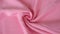 Soft pink color satin fabric texture seamless with beautiful closeup and shiny detail fabric