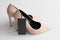 Soft pink high heels with black price tag mockup