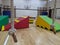 Soft play equipment spread out across the gym floor