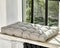 Soft Scandinavian style gray cushion lying on windowsill