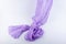 Soft semitransparent purple fabric flowing on white background