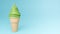 Soft serve ice cream of green tea flavours on crispy cone on blue background.,3d model and illustration