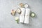 Soft SPA flat lay with white towels, candles, handmade soap and flower