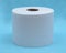 Soft strong and absorbent white toilet paper isolated on blue